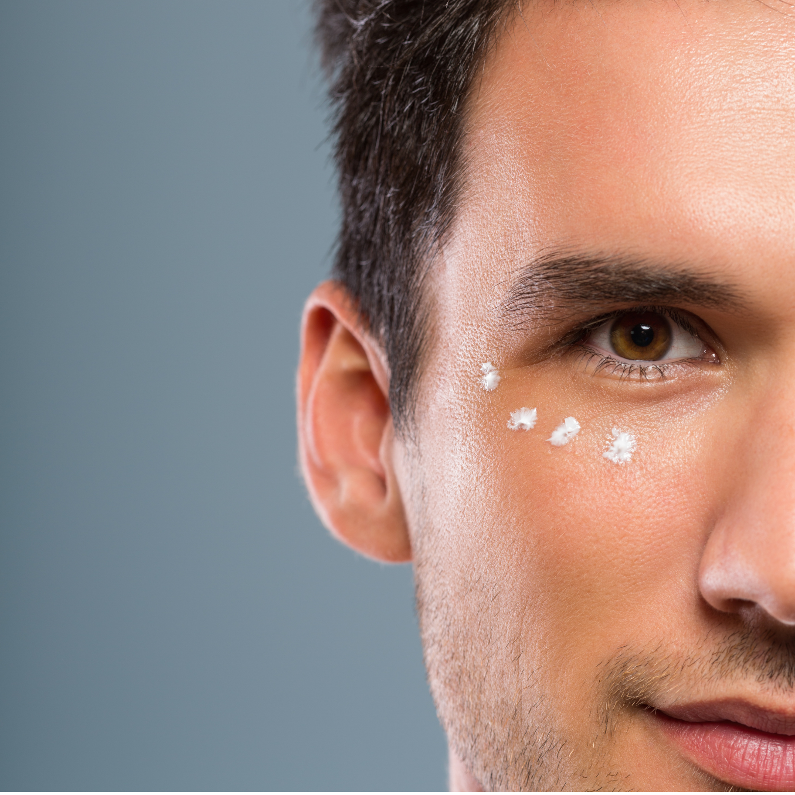 Man using skin care products