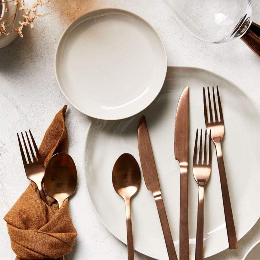 Linen Napkins Set 2 Tobacco alongside elegant bronze cutlery on a stylish dining table setting.