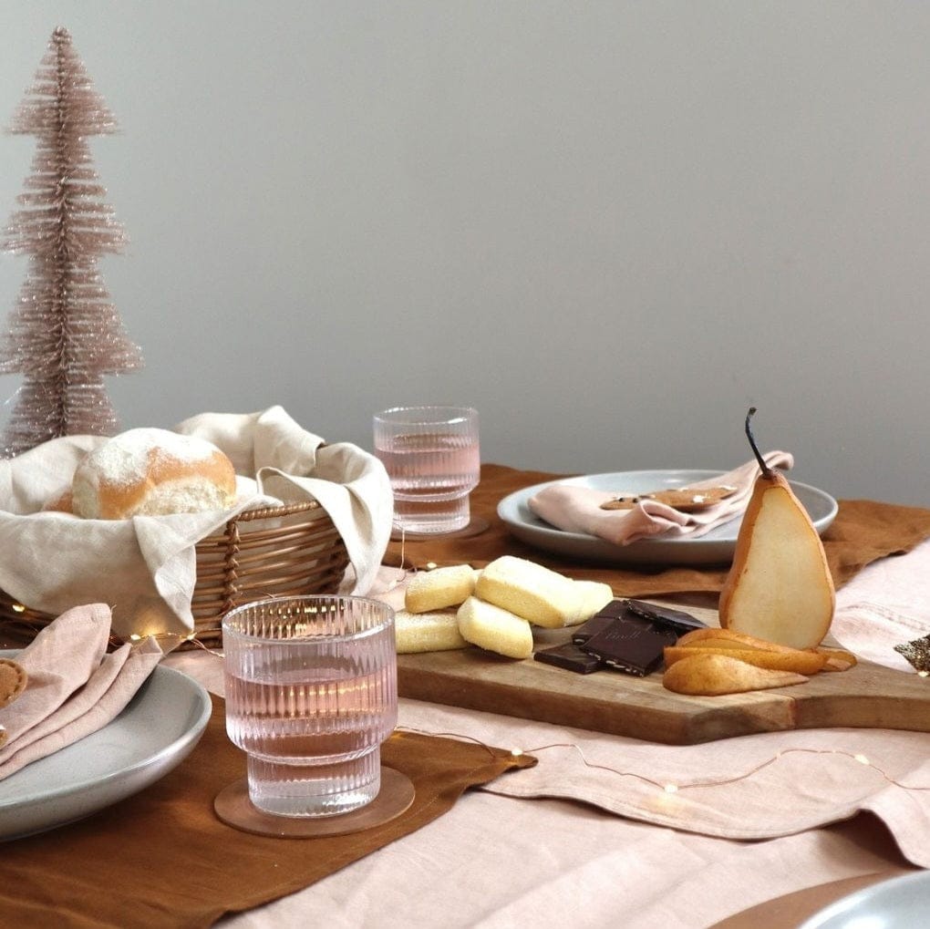 Linen Placemats Tobacco natural textured table decor with food, glasses, and festive elements.