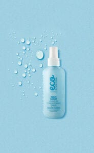 Ecoforia Aqua Moist Leave-In Conditioner Spray 200ml bottle on a blue background with water droplets