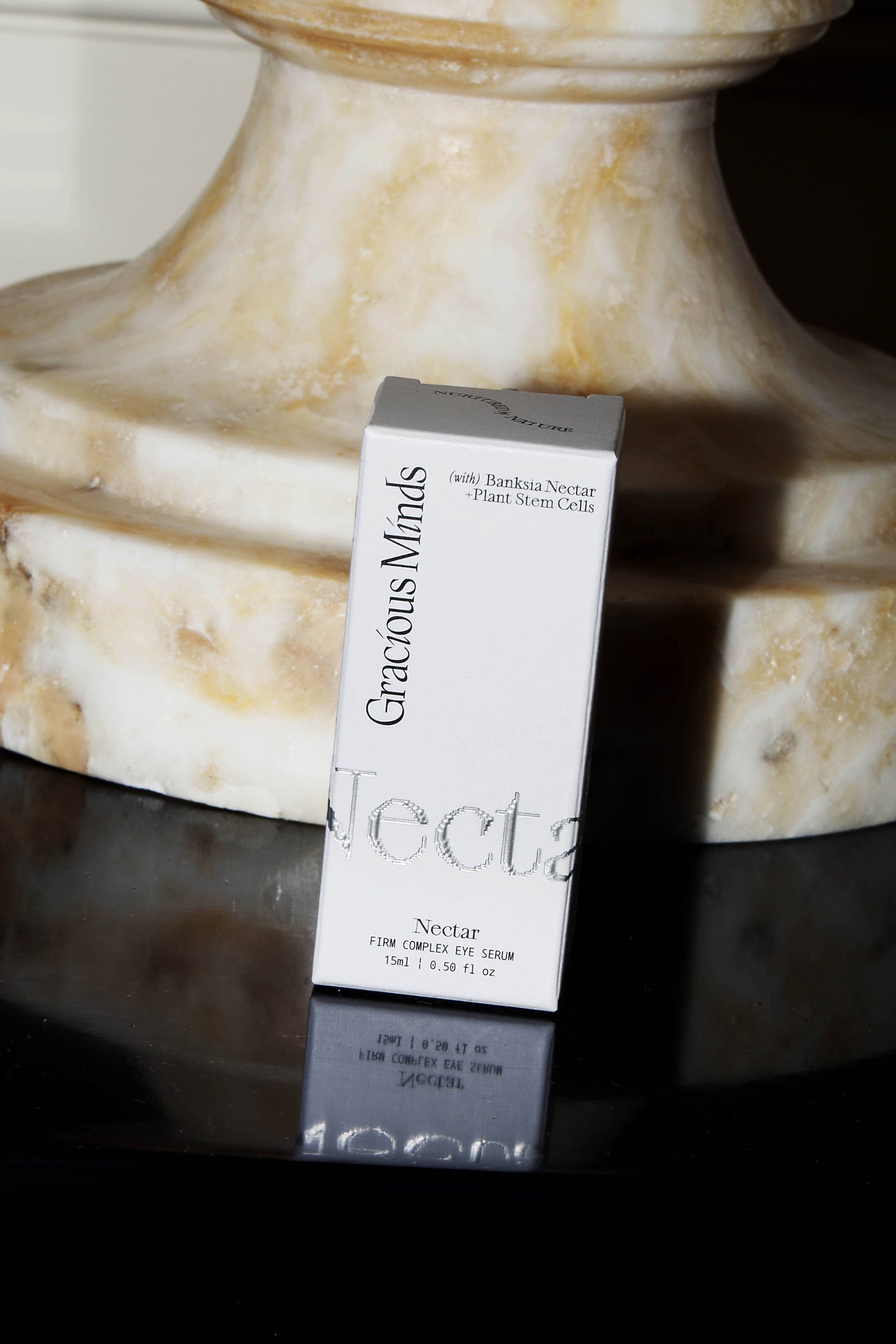 Gracious Minds Nectar Firming Eye Serum Elixir 15ml packaging on marble surface