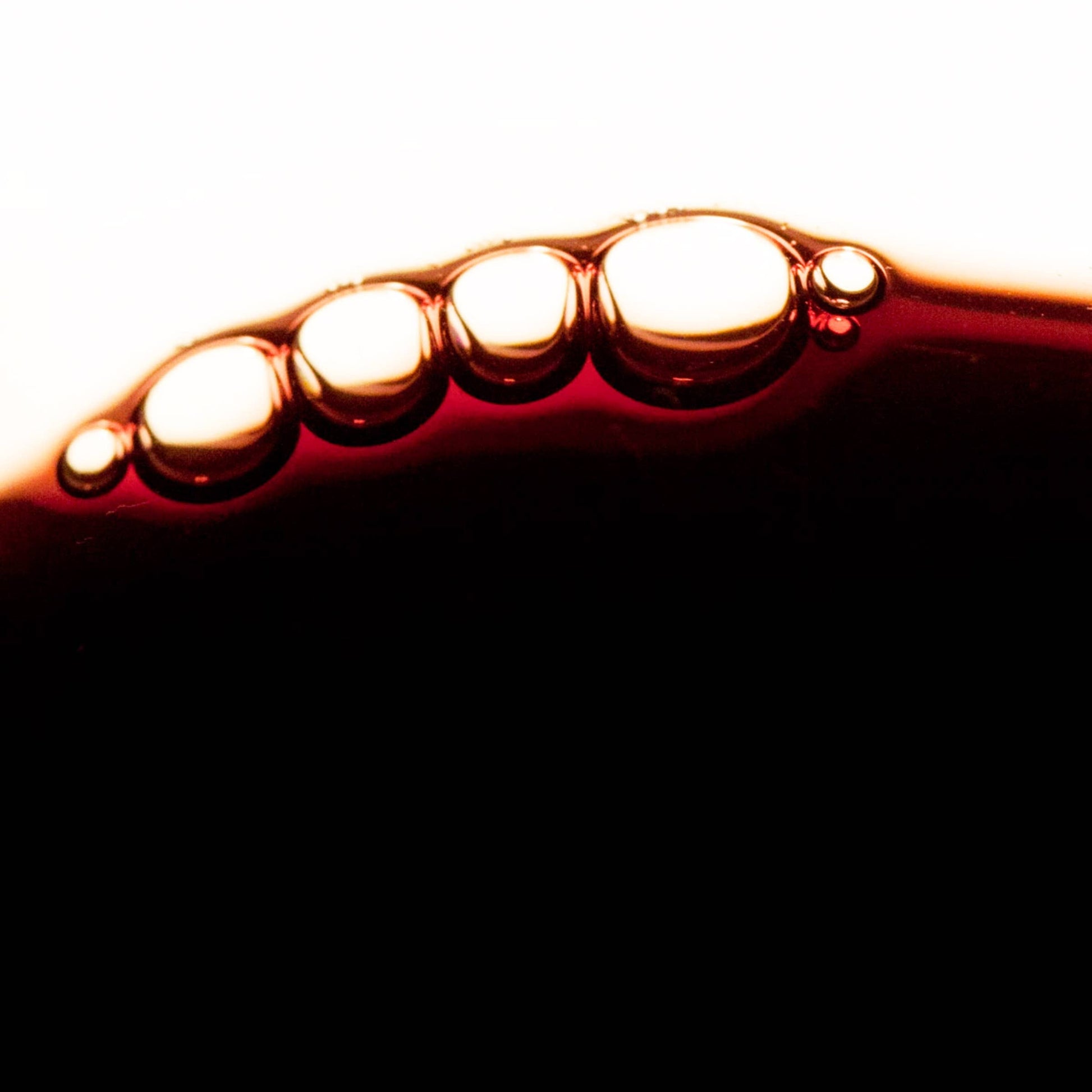 Texture detail of Gracious Minds Plum Royale Superlative Antioxidant Concentrate liquid.