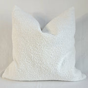 Boucle Cushion Cover Alabaster displayed in a soft textured design, enhancing home decor with elegance and comfort.