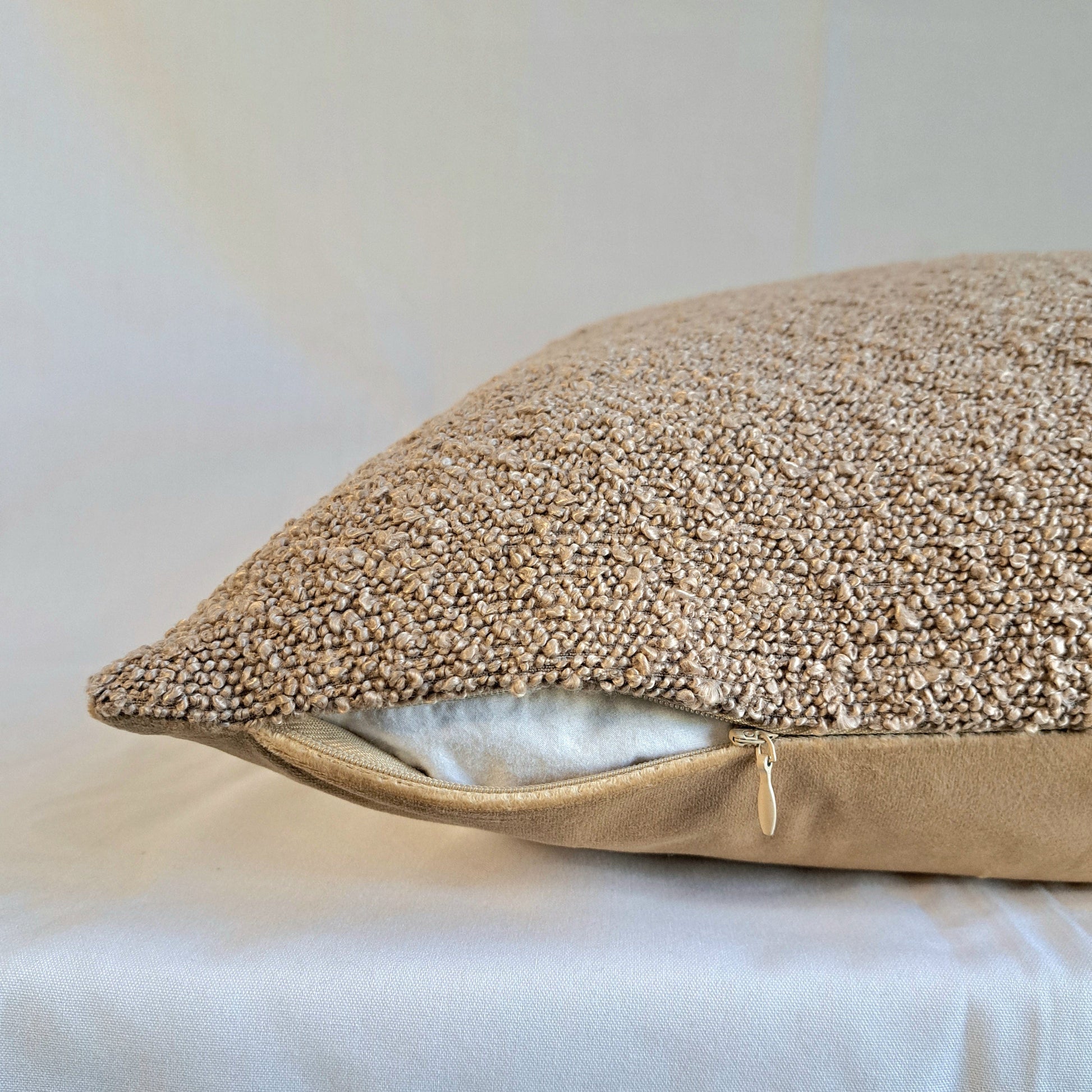Boucle Cushion Cover Latte with soft textured surface, showcasing elegant design and plush feel for home decor.