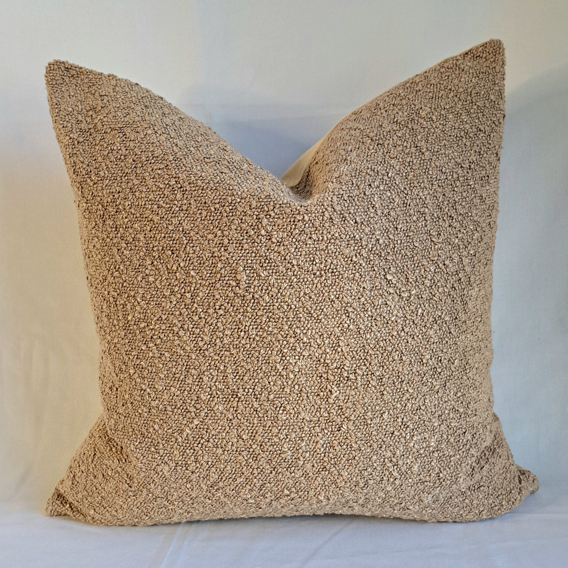 Boucle Cushion Cover Latte soft textured pillow ideal for home decor, adding warmth and elegance to living spaces.