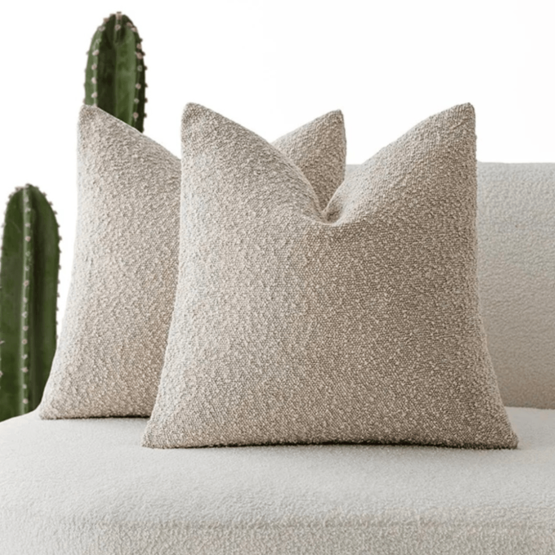 Boucle Cushion Cover Sepia on a couch, featuring a soft textured finish that enhances home decor.