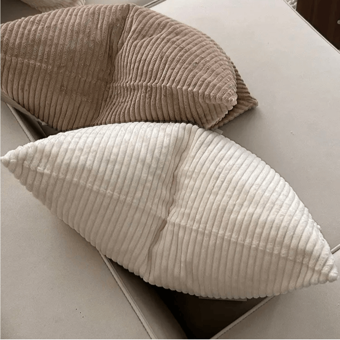 Corduroy Cushion Cover Almond in soft textured beige and cream colors on a table, enhancing home decor.
