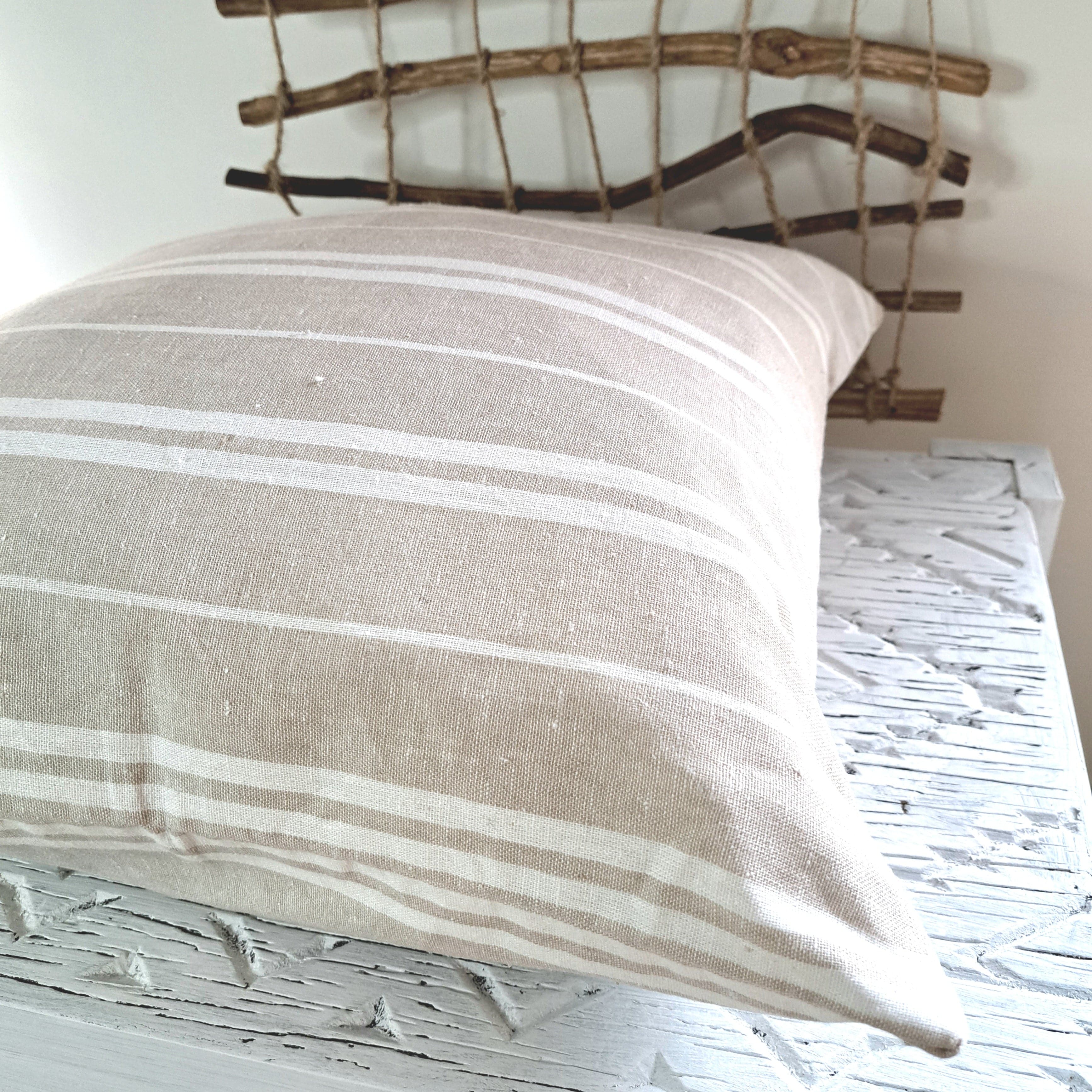 Oatmeal Stripe Linen Cushion Cover natural textured decor on a rustic wooden table