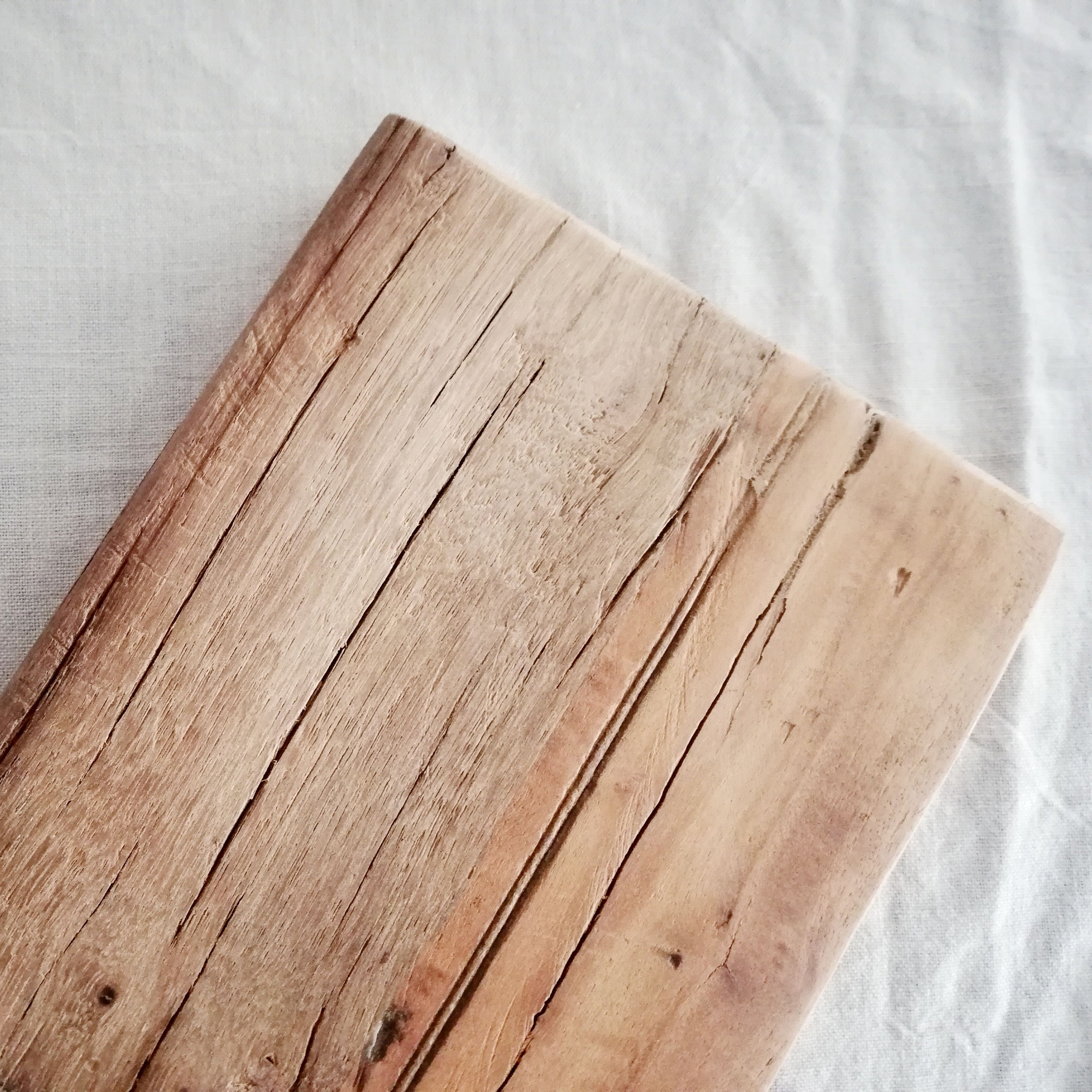 Close-up of Reclaimed Tapas Boards Handmade showcasing unique textures and grain patterns of the reclaimed wood.