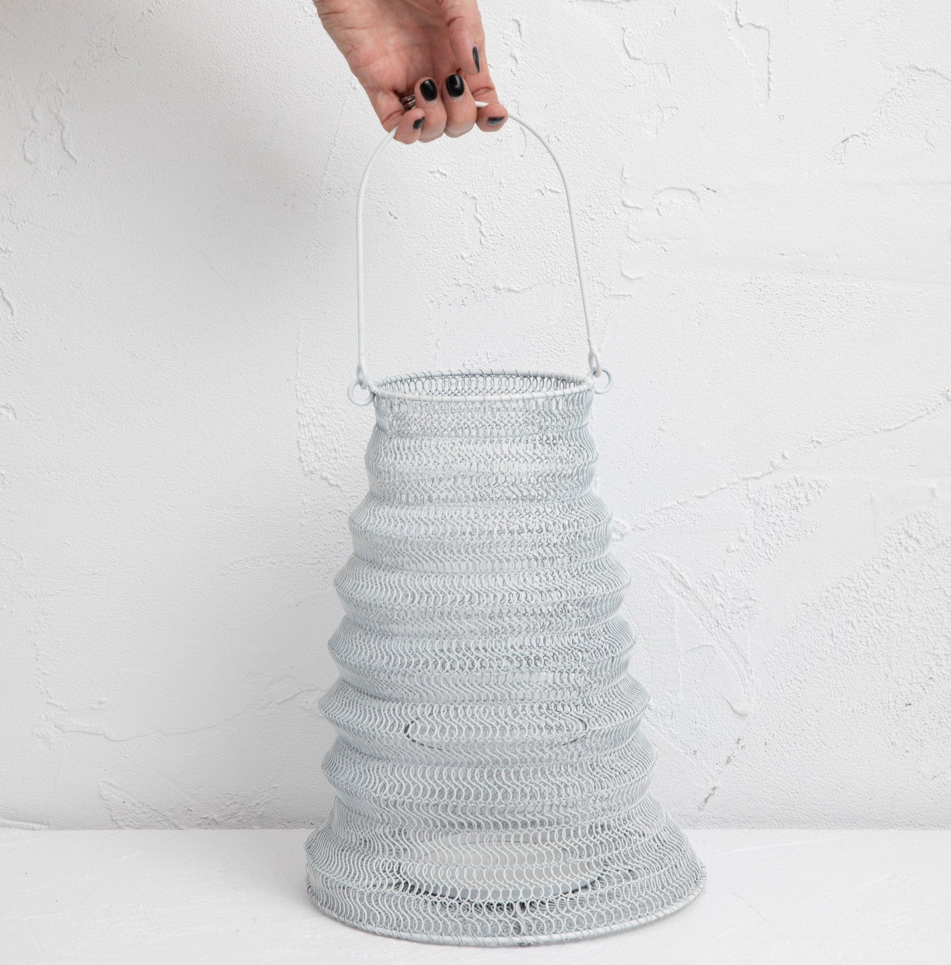 Mesh Lanterns White iron mesh lantern with a unique textured design, perfect for decorative lighting.