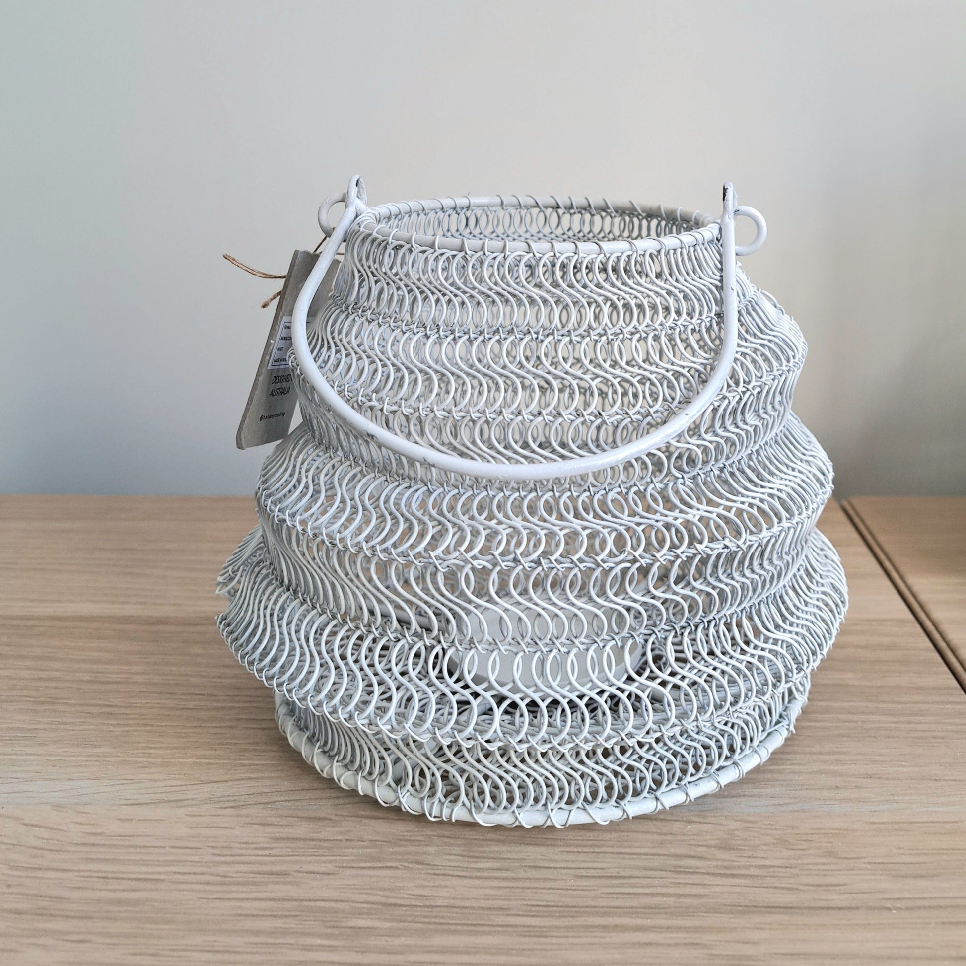 Mesh Lanterns White decorative lighting in textured iron mesh design for a calming atmosphere.