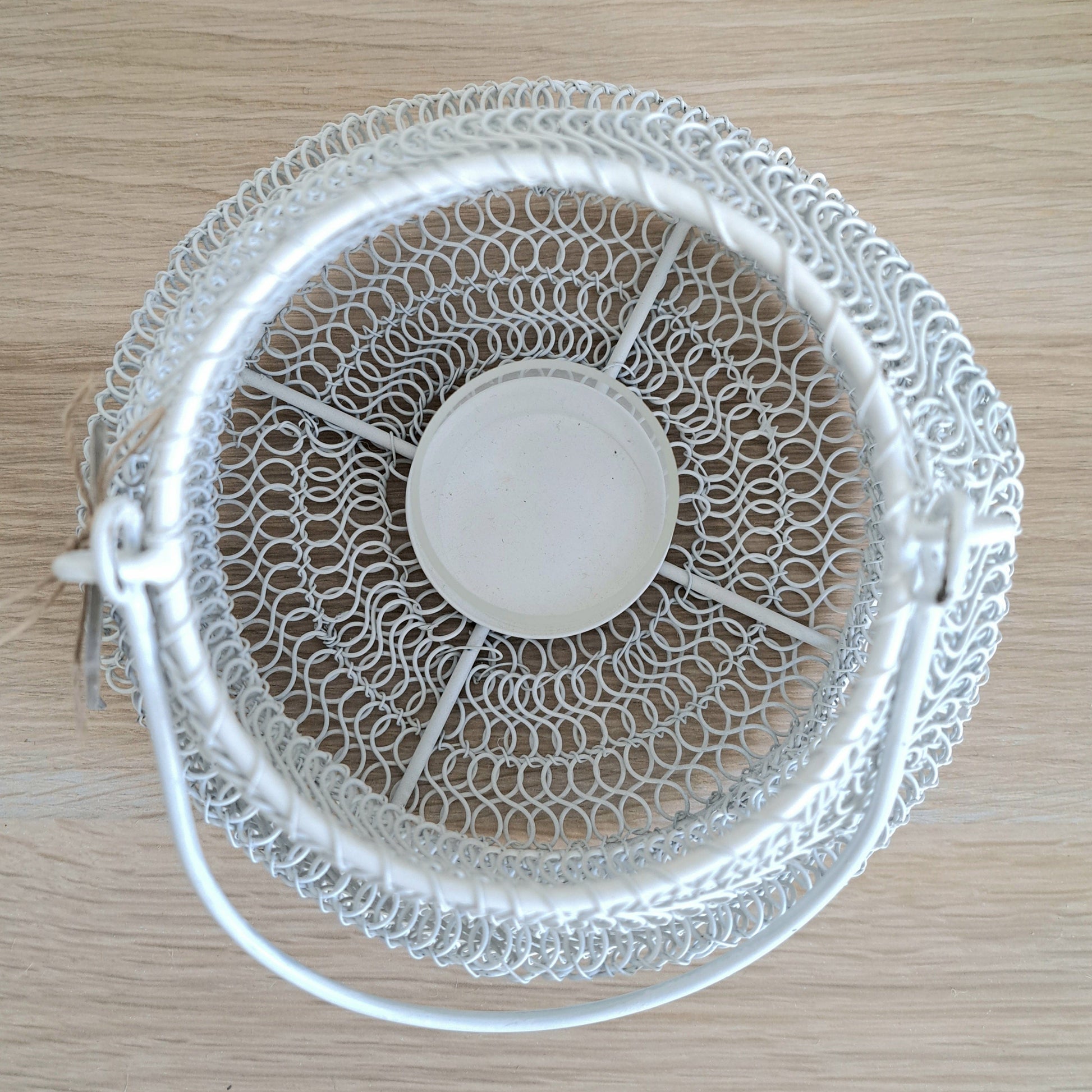 Top view of Mesh Lanterns White showcasing its textured iron design and organic shape for decorative lighting.
