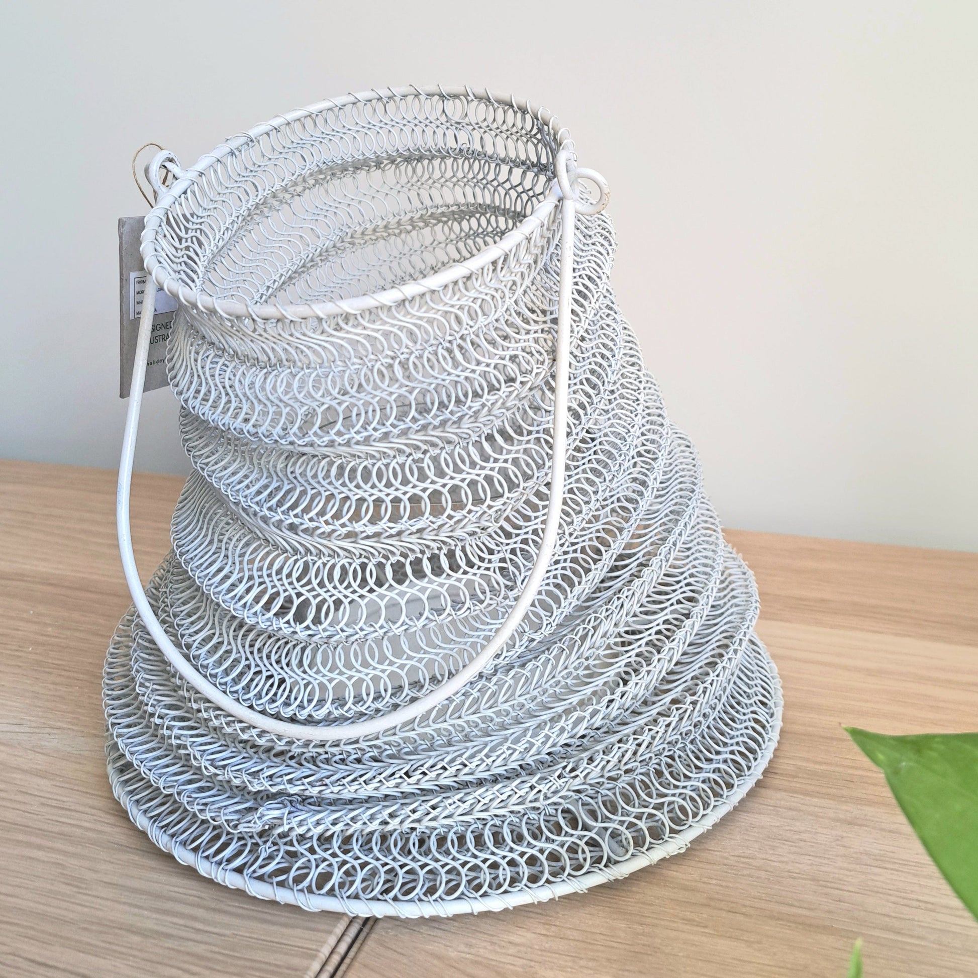 Mesh Lanterns White showcasing organic shaped iron mesh design for decorative lighting.