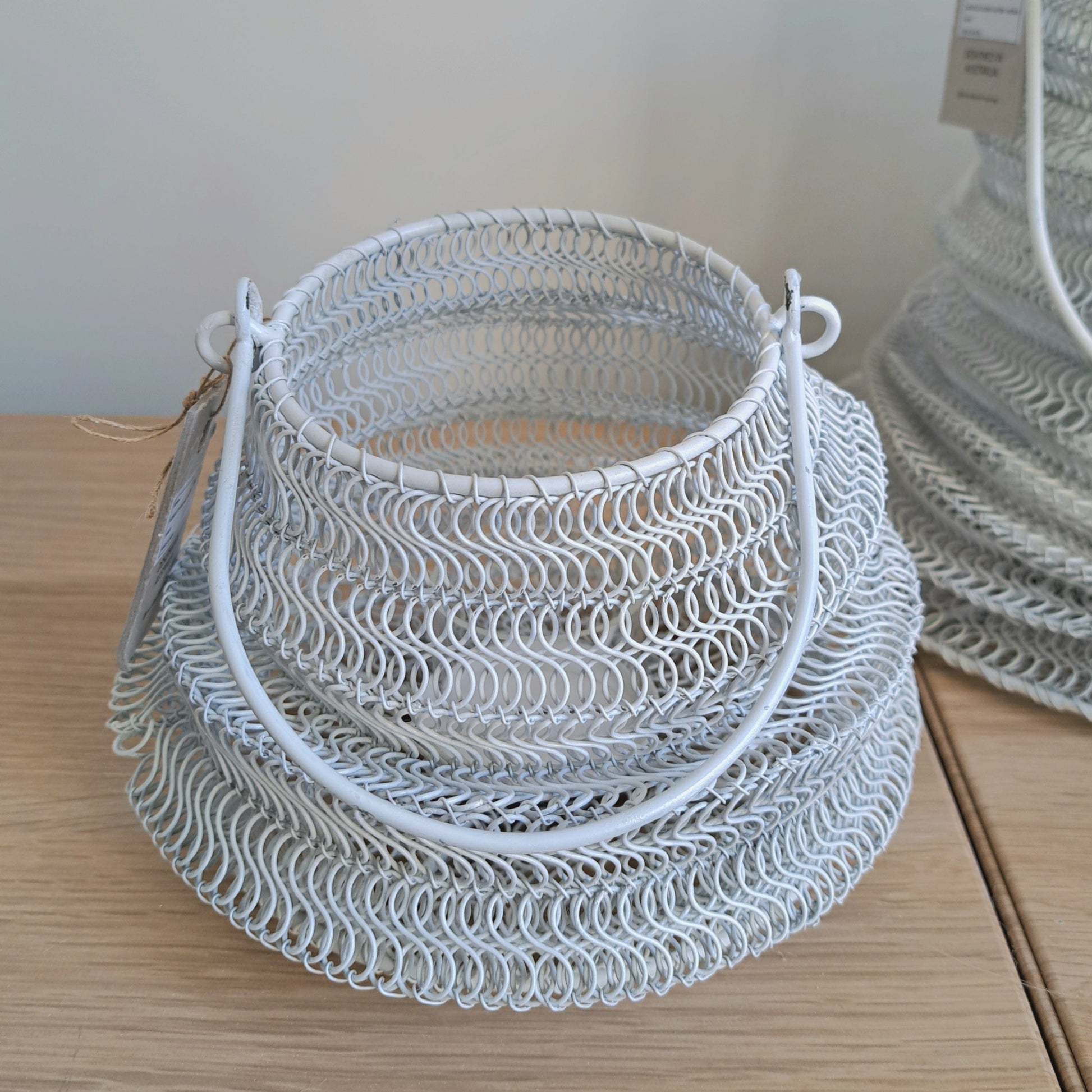 Mesh Lanterns White textured iron decorative lighting with organic shaped design.