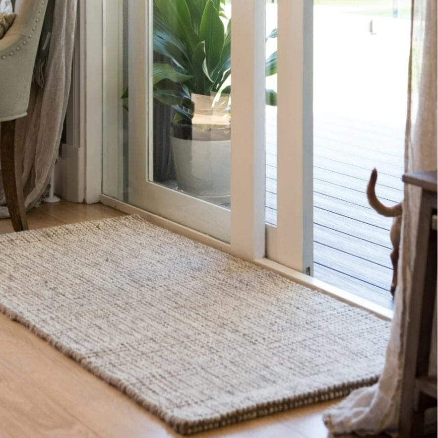 Jute Wool Rugs & Runners natural textured rug placed near a doorway, adding warmth to home decor.