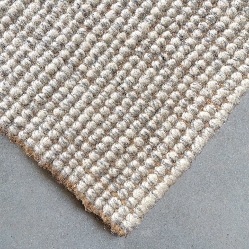 Close-up of a Jute Wool Rugs & Runners showing the natural woven texture and soft fibers.