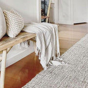 Jute Wool Rugs & Runners displayed in a cozy living space with textured decor and soft textiles.