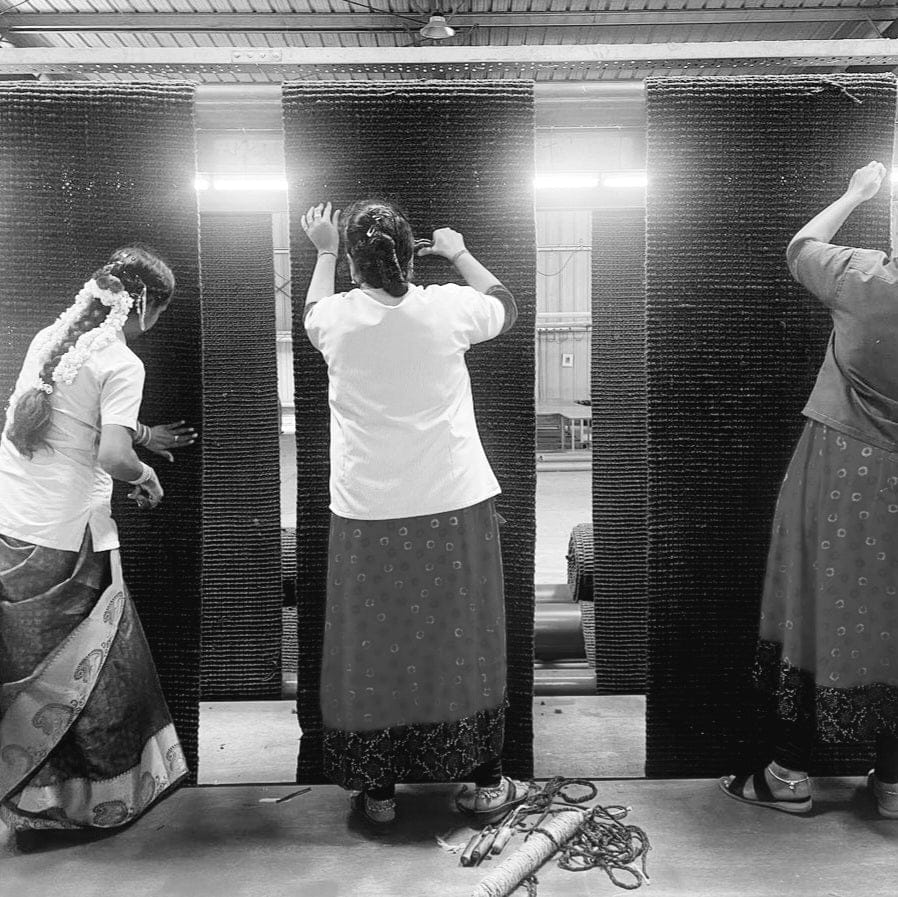 Women weaving Natural Jute Rugs Fringe Edge, showcasing traditional craftsmanship and textured home decor.