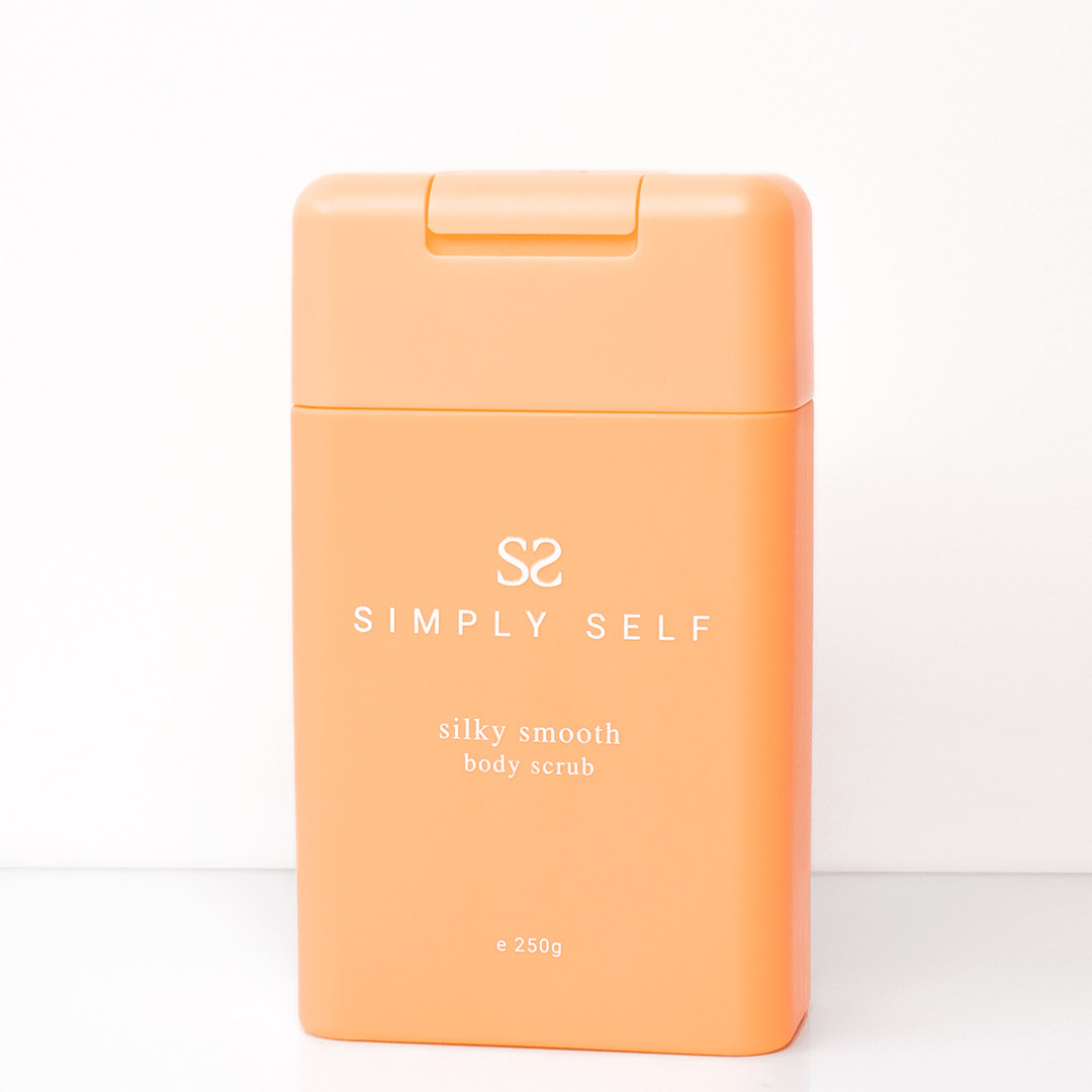 Simply Self Glow Essential Body Bundle - Silky smooth body scrub in orange bottle, 250g, for cleansing and nourishing skin.