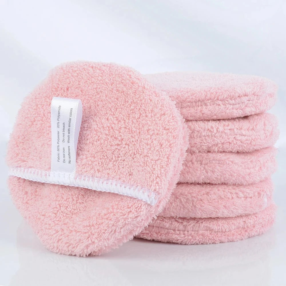 Stack of pink SNACC Makeup Remover Pads showcasing soft microfiber texture.