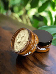 SNACC Beauty Replenish & Glow Green Clay Face Mask on a wooden surface