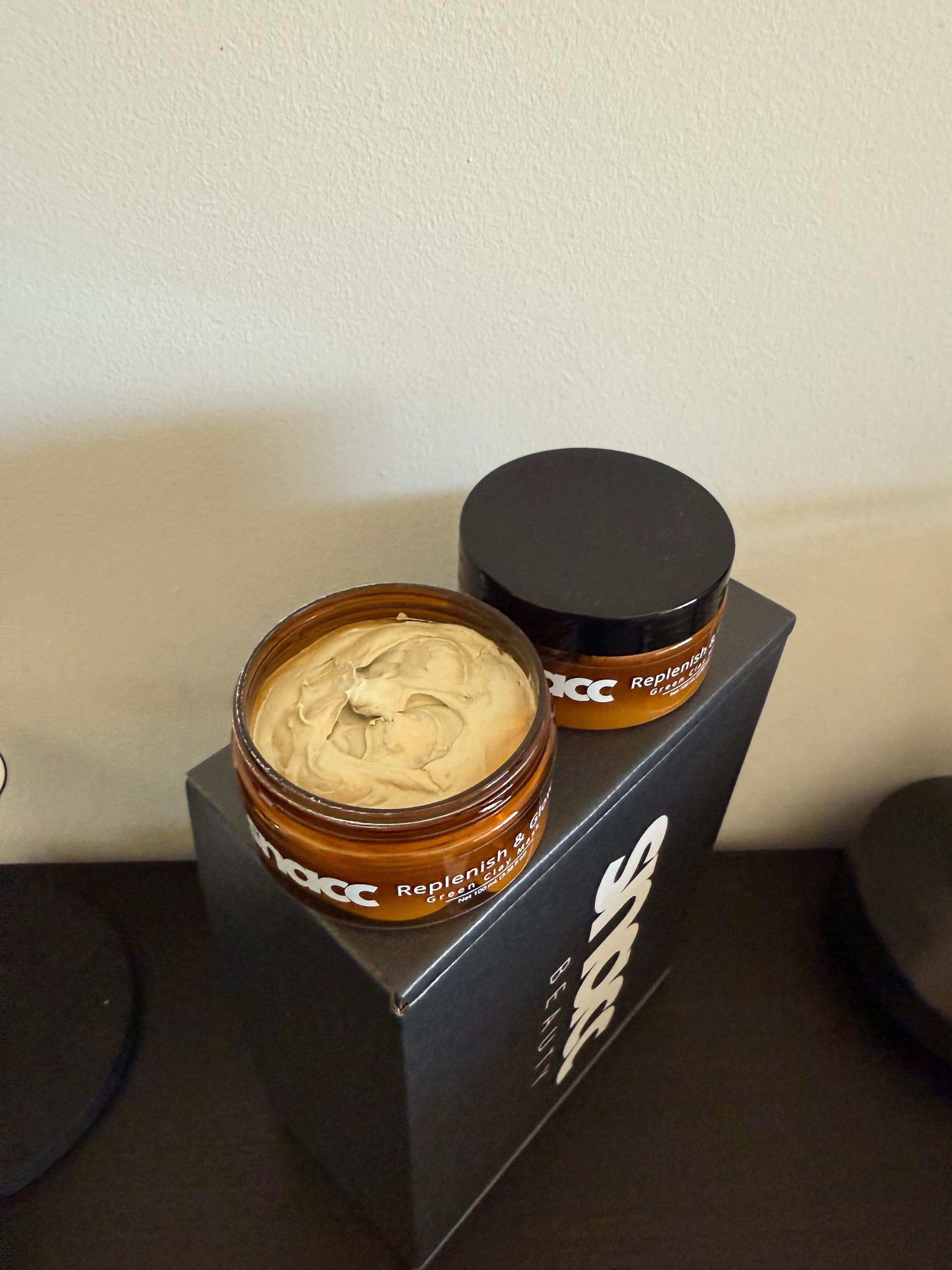 SNACC Beauty Replenish & Glow Green Clay Face Mask jar on display