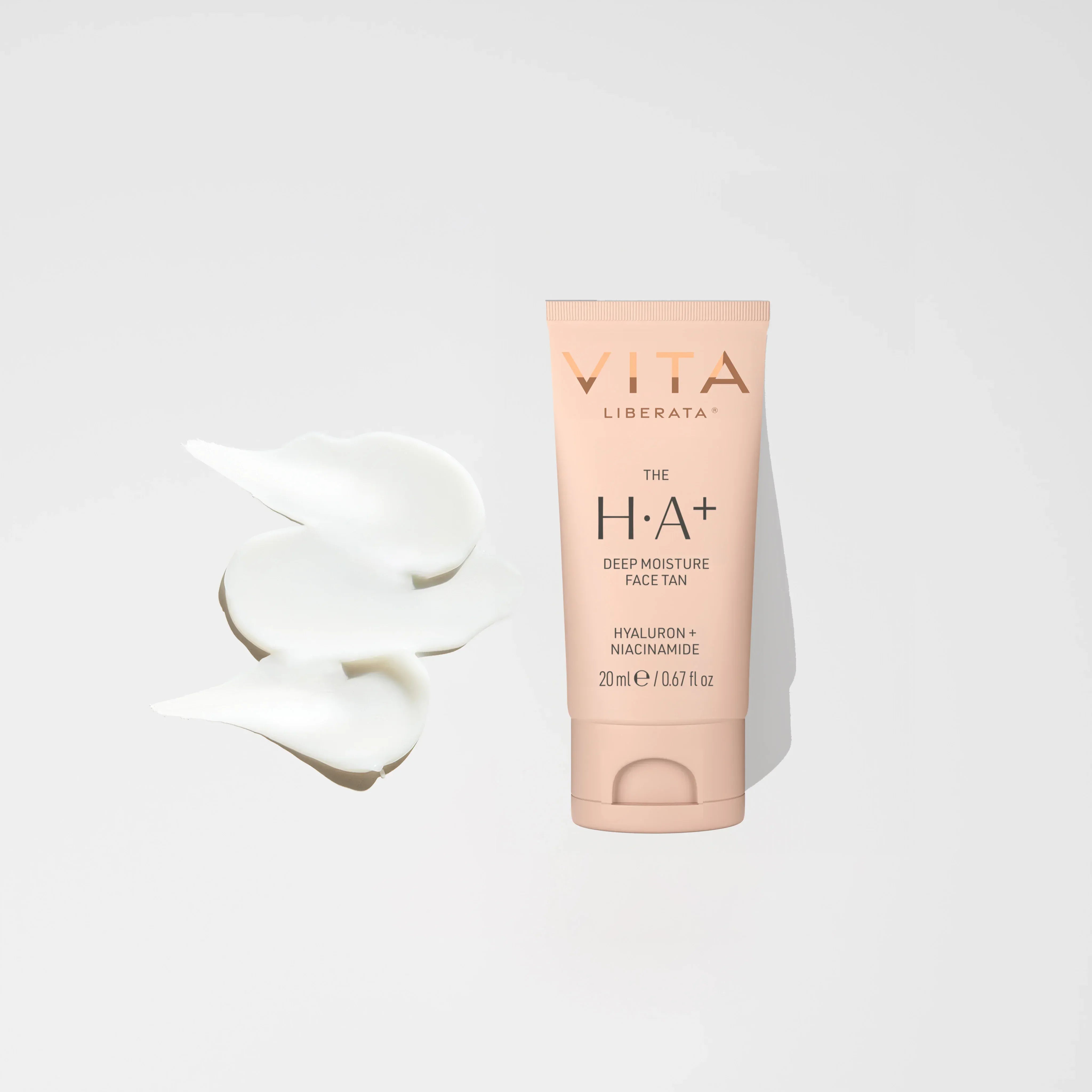 Vita Liberata Deep Moisture Face Tan bottle with cream texture on white background, showcasing hydrating self-tanning treatment.