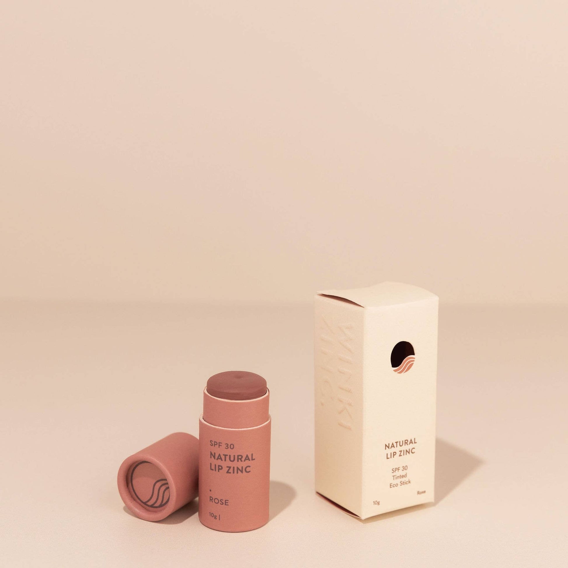 Winki Zinc Tinted Natural Lip Zinc balm and box on neutral background